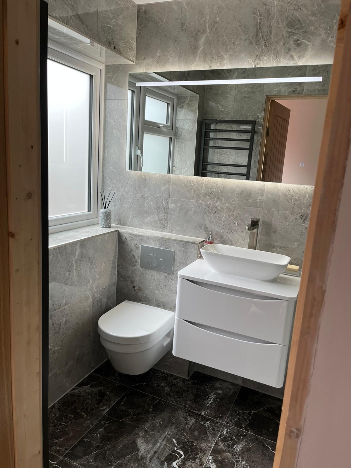 Soft grey ensuite · floating vanity